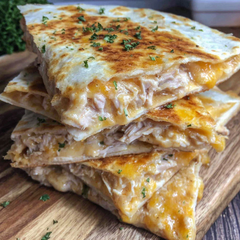 A stack of three taco bell quesadillas.