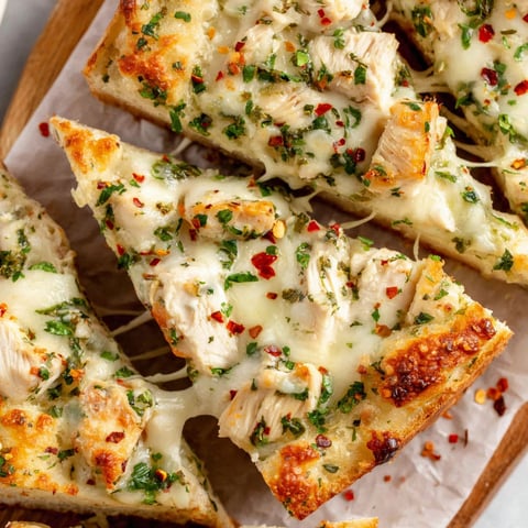 A slice of chicken Alfredo knoblauchbrot.