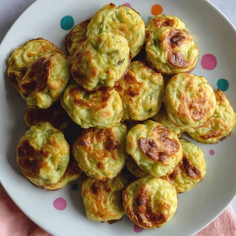 A plate of food with a colorful polka dot pattern.
