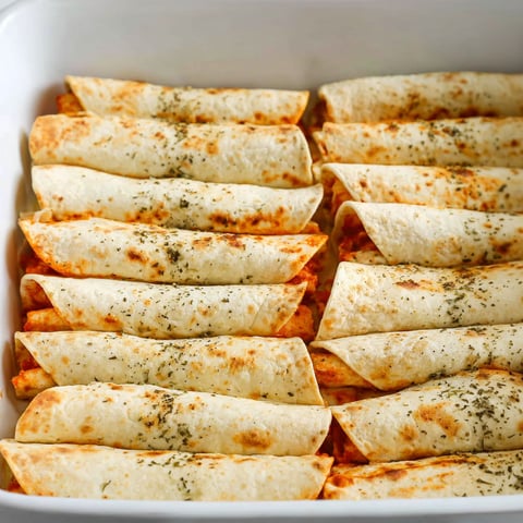 A pan of pizza roll ups.