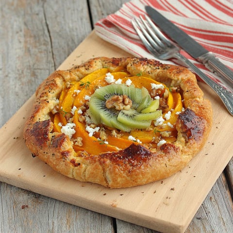 A pizza with a slice missing.