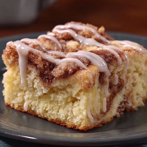 A slice of cinnabon cinnamon roll cake.