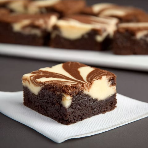 A piece of chocolate cheesecake on a plate.