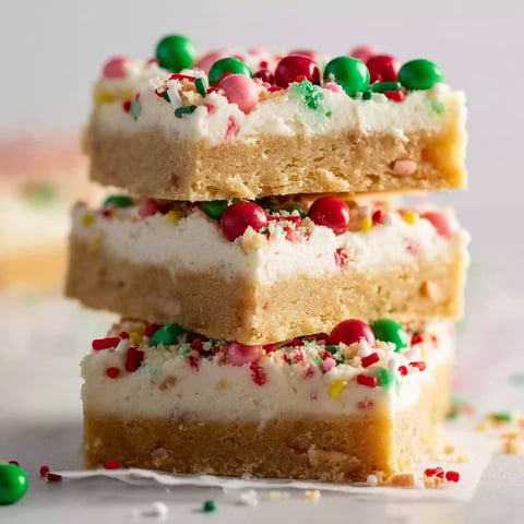 Three bars of Christmas sugar cookie bars.