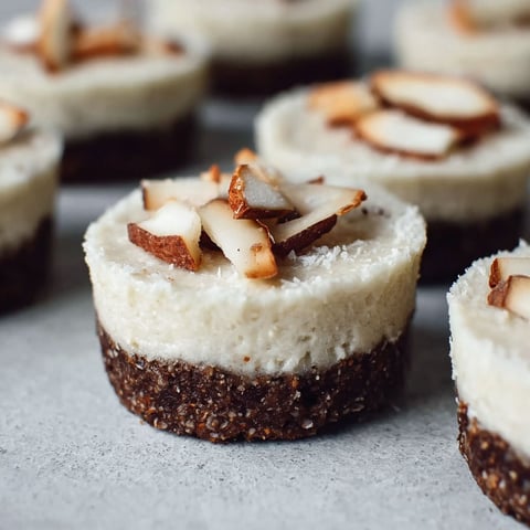 A close up of a vegan coconut cupcake.